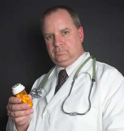 Doctor offering pills