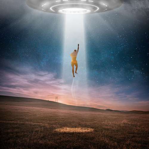 Man being taken by UFO