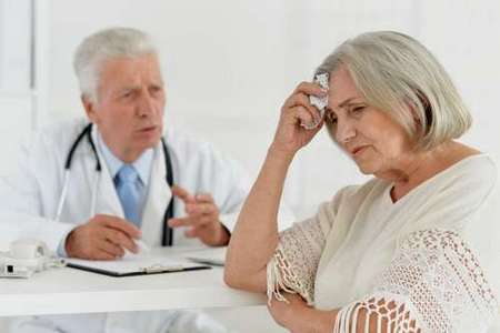 Doctor counseling unhappy woman.